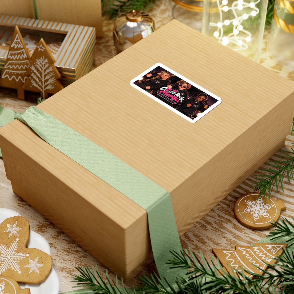 Sticker applied to a gift box, showing the vibrant 'Momfia' design amidst holiday decor.