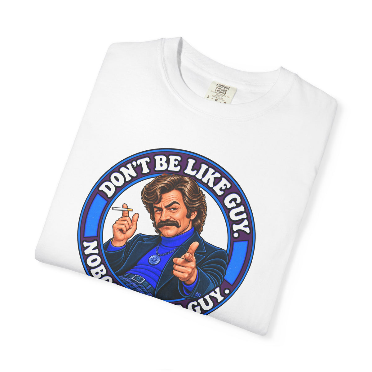 Folded white t-shirt with retro Don’t Be Like Guy artwork