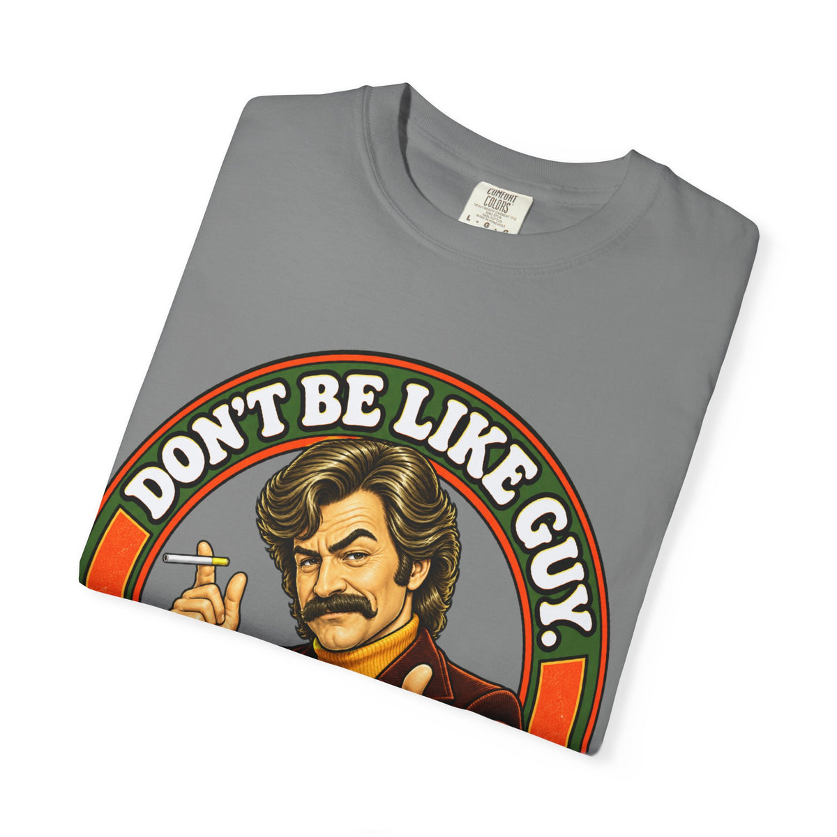 Folded gray t-shirt showing 'Don't Be Like Guy' illustration