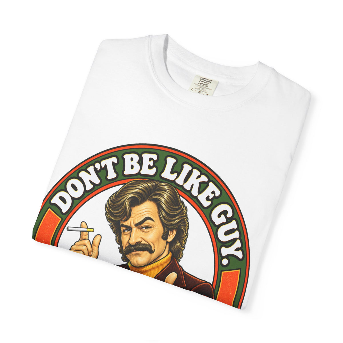 Folded white t-shirt showing 'Don't Be Like Guy' illustration