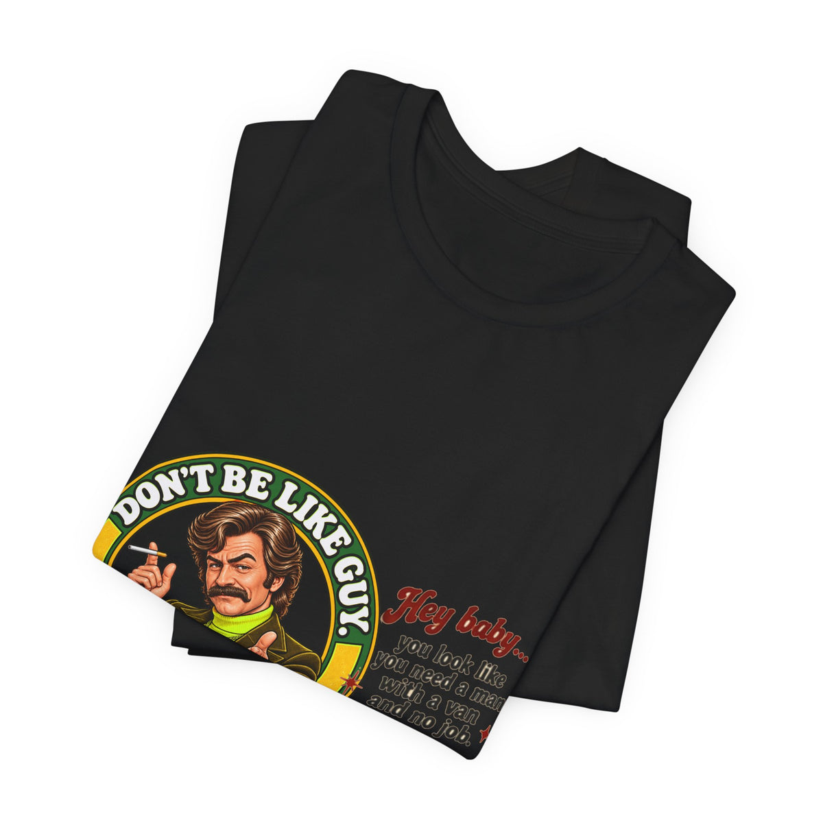 Folded black Don't Be Like Guy graphic T-shirt with visible design