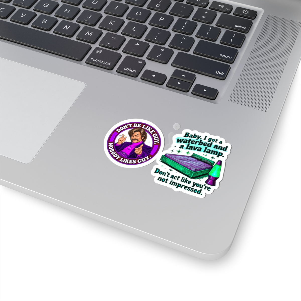 Sticker pack on a silver laptop, adding bold retro humor and unique flair.