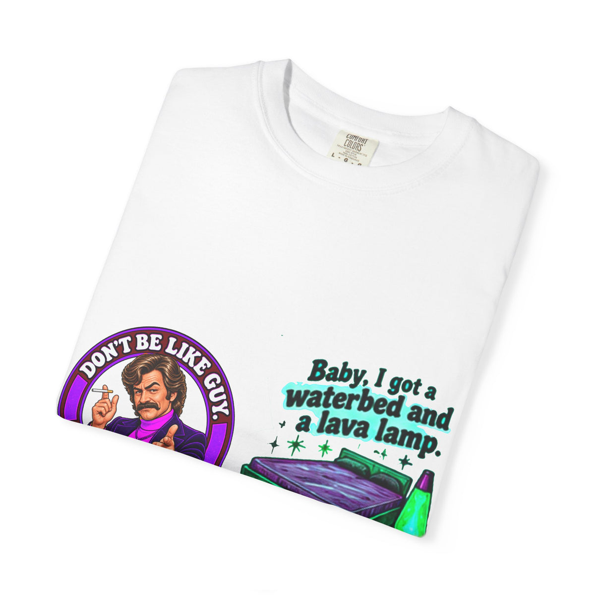 Folded white t-shirt showing colorful graphic and humorous text