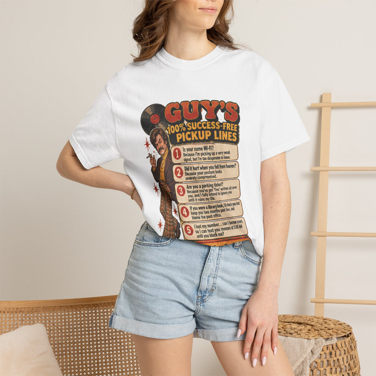 Person wearing white t-shirt with joke pickup lines graphic