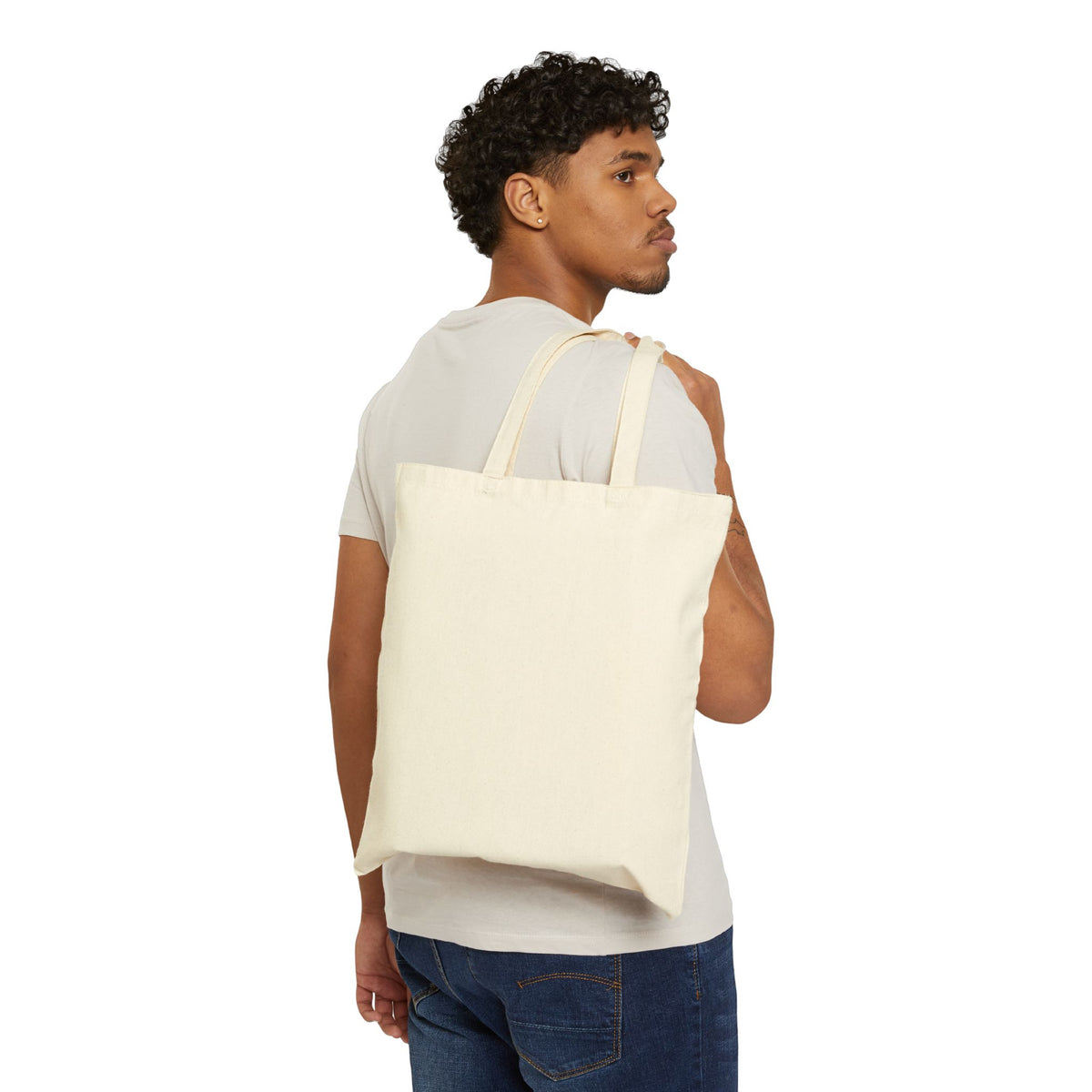 Man carrying plain natural canvas tote bag