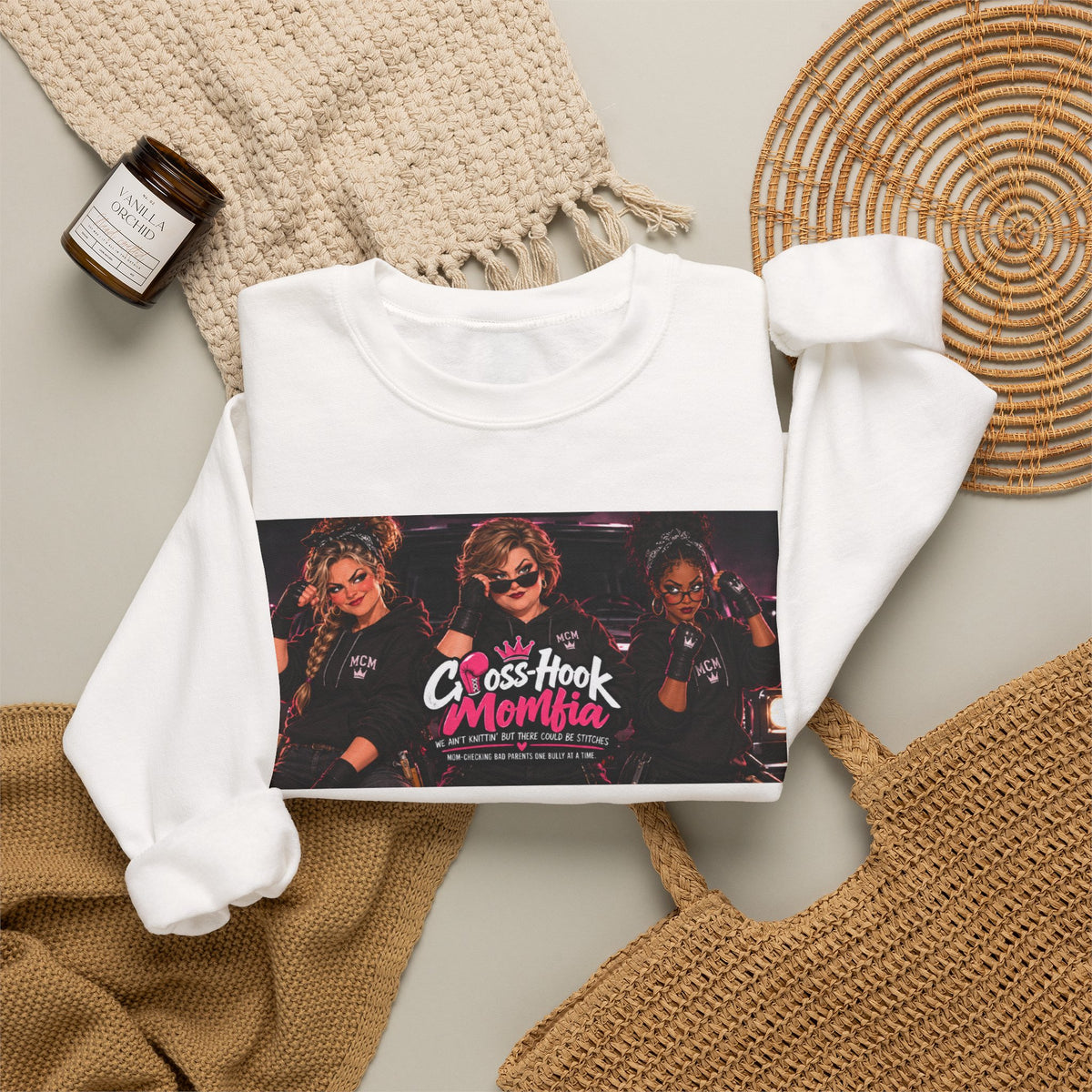 Styled flatlay of white Cross-Hook Momfia crewneck with home accessories