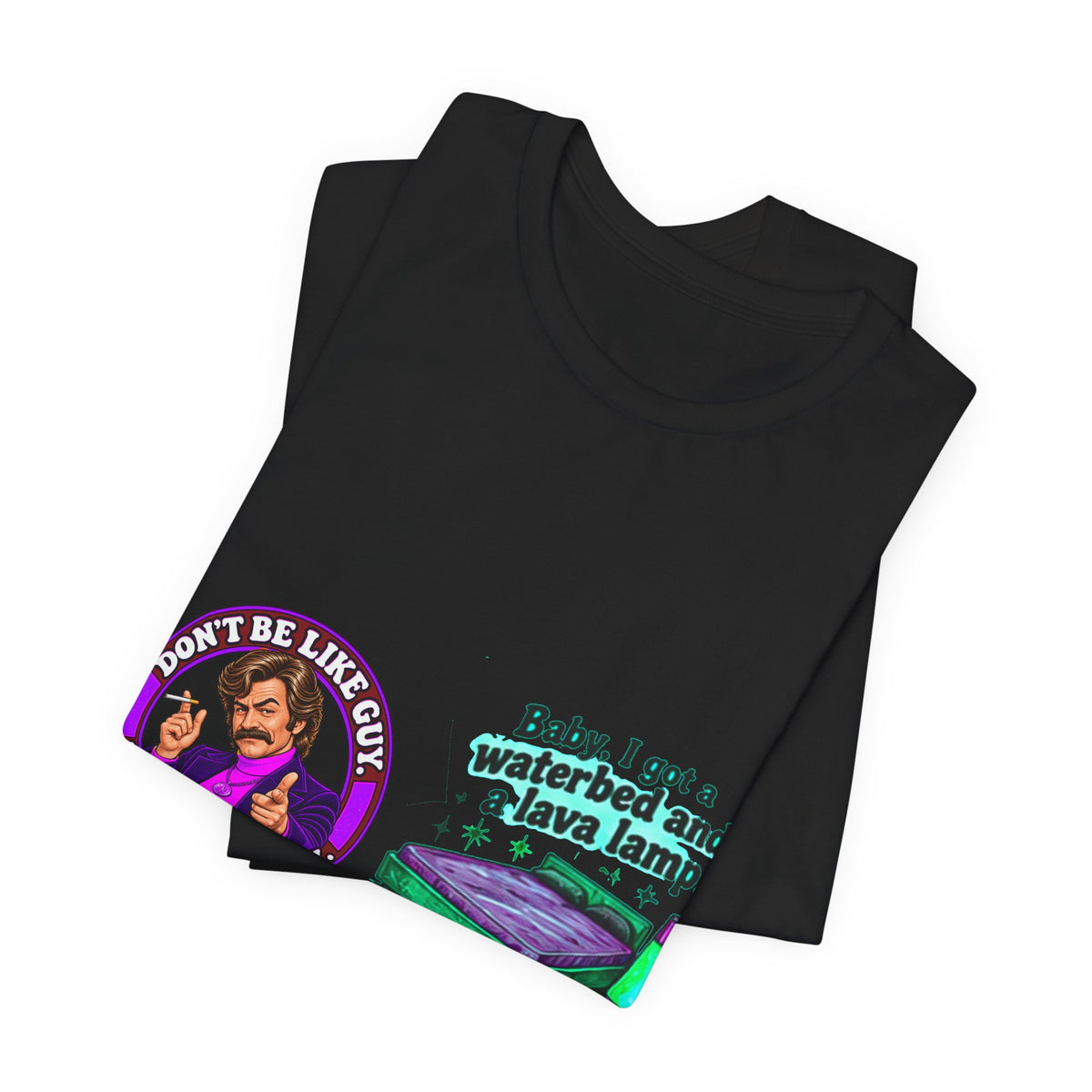 Folded black t-shirt showing retro graphic on front