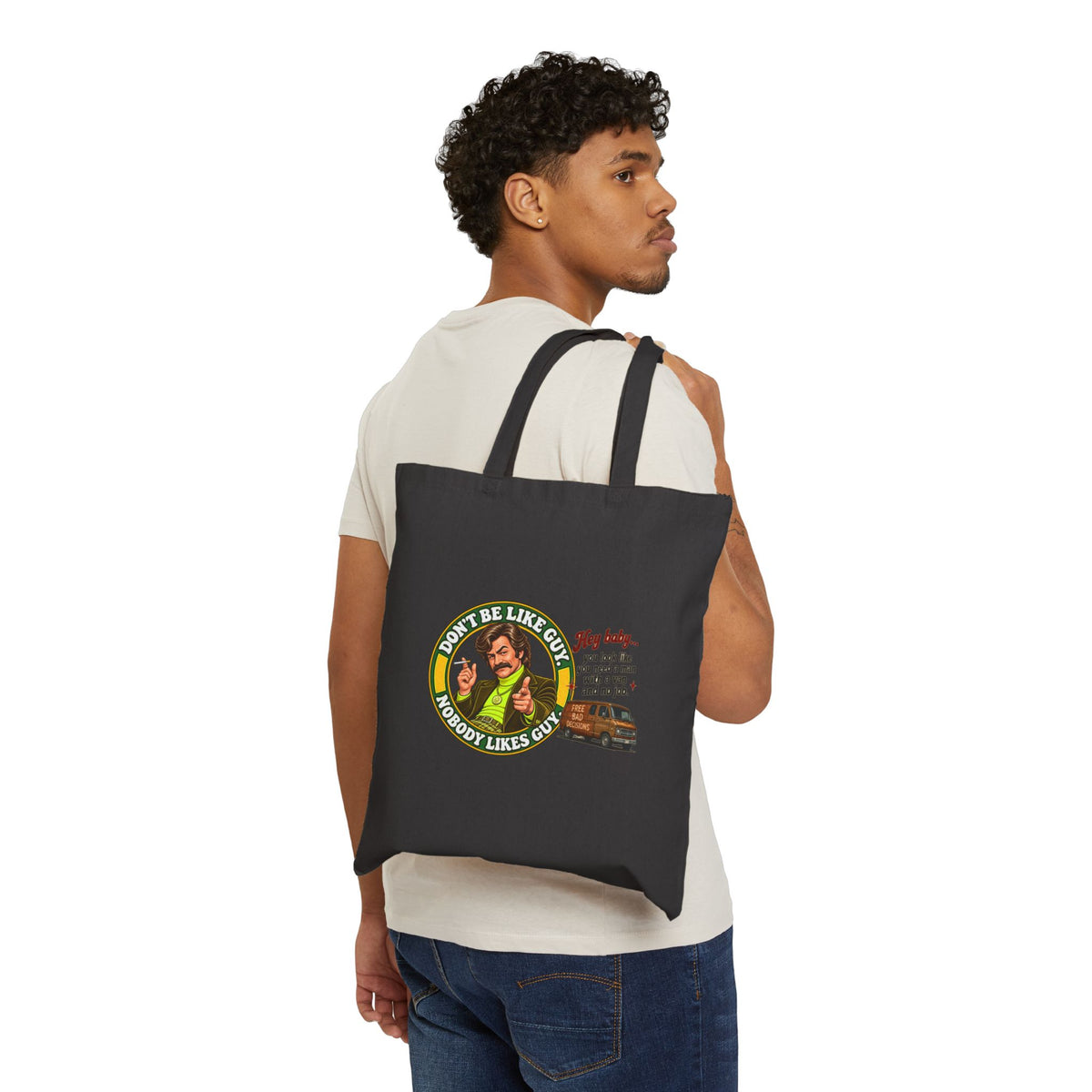 Person carrying black tote bag with funny retro graphic