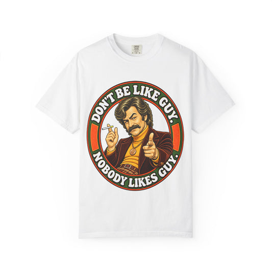 White t-shirt with 'Don't Be Like Guy Nobody Likes Guy' retro illustration on front